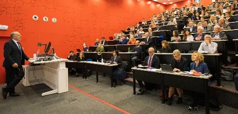 Academic giving a talk in a lecture theatre