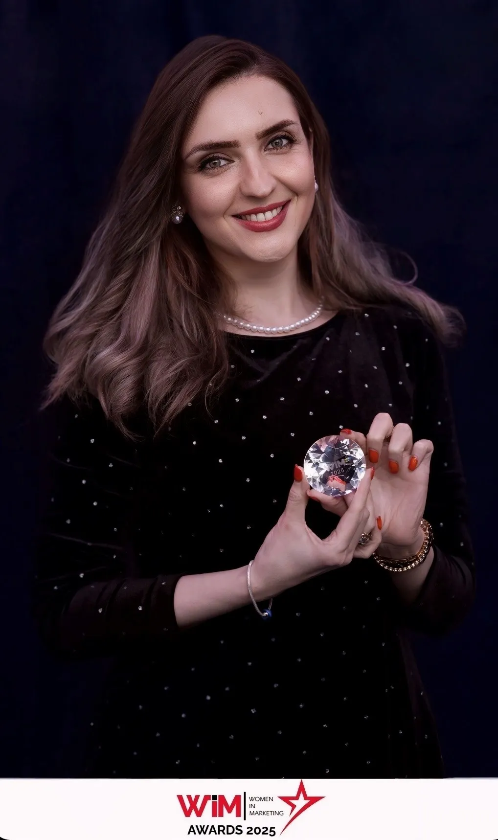 Mina Tajvidi receiving the WiM 2025 Award
