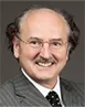 Photo of Professor Peter Cameron smiling and wearing a grey suit