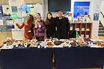 Queen Mary Legal Advice Team at their cake stand for the Legal Bake 2022