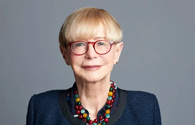 Malgosia Fitzmaurice wearing a nazy jacket and glasses.