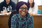 Queen Mary law student sat in a lecture
