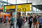 People walking through the departure lounge of an airport