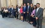 Professor Rosa Lastra and Dr Daniele D'Alvia with Queen Mary LLM students standing by a door to the Bank of England.