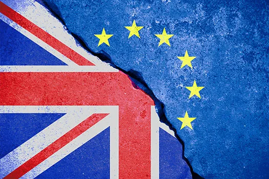 Union Jack and EU flag split down the middle by a crack
