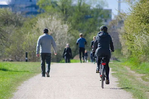People running, jogging and walking in a park