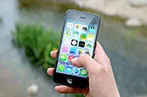 Person's hand holding an iphone