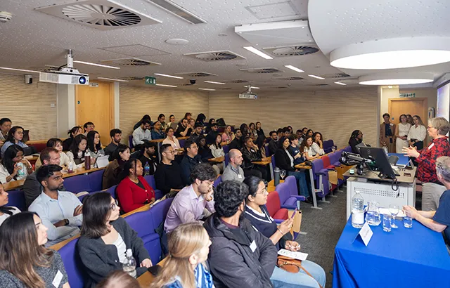 Professor Hornle speaking to guests sat in a lecture theatre.