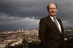 Neil MacCormick against the backdrop of a city