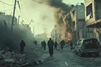 People walking down a bombed street in Gaza. There is rubble laying on the ground, cars burnt out and smoke billowing out from buildings.
