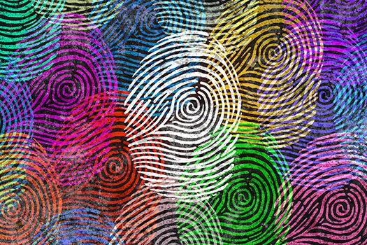 Lots of multicoloured finger prints on a screen