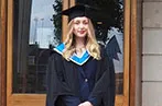Matilda McDermott-Krasker at graduation. She is wearing a mortar board and graduation gown.