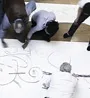 Students drawing on a big A2 sheet of paper