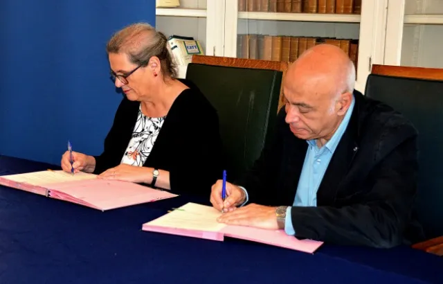 Professor Morag Shiach and Professor Georges Haddad signing documents at the launch of the Double LLM in Paris