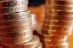 Some pound sterling coins stacked in columns
