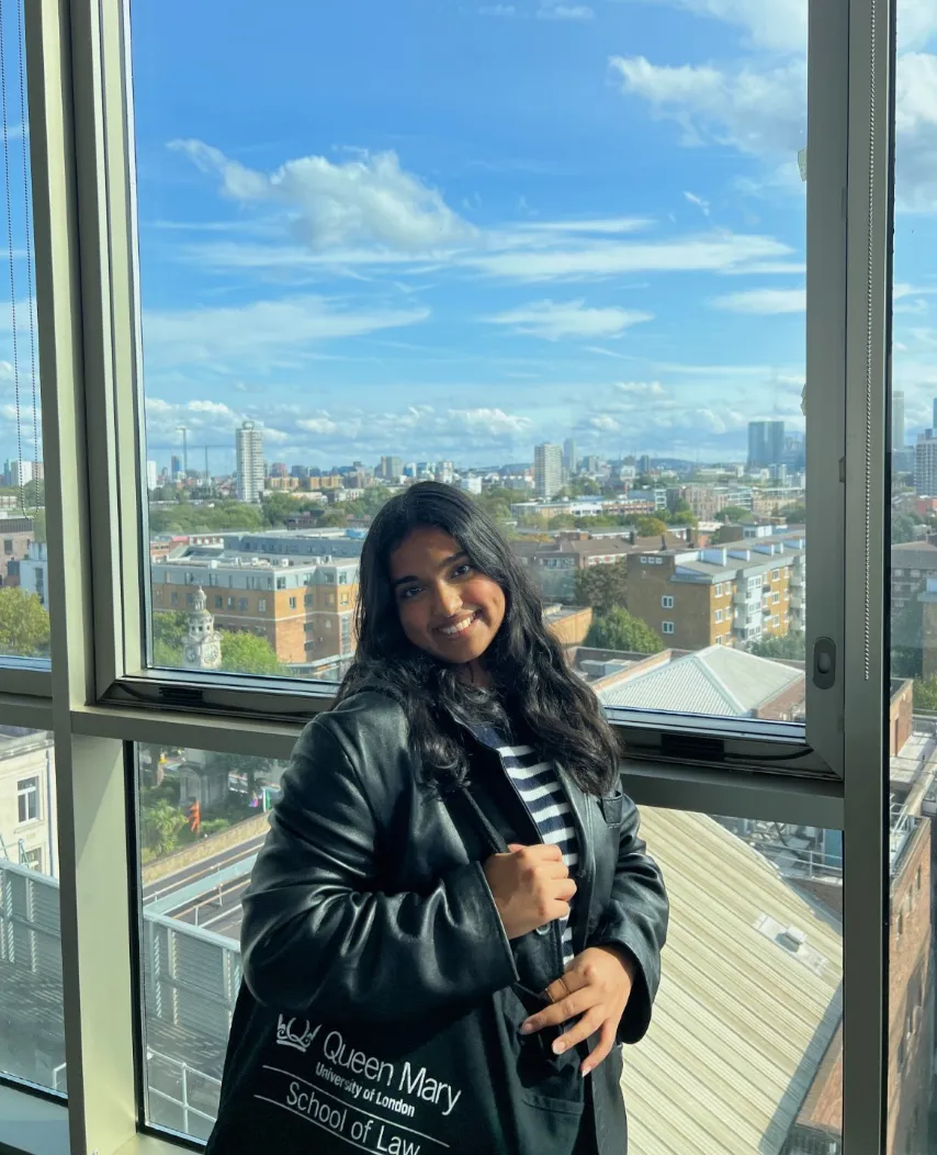 Vandy at the Graduate Centre with London skyline in the background