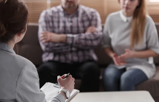 Couple speaking to therapist