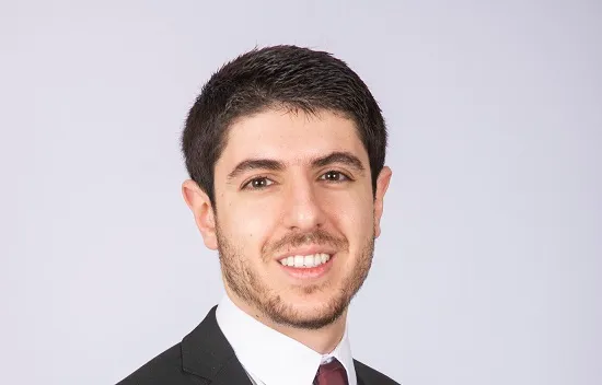 Man in suit smiling at camera