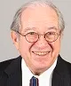 Prof Lew, older man with grey hair and small round glasses smiling