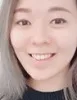 Asian woman with long blond hair