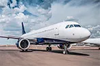 A passenger airplane sat on a runway.