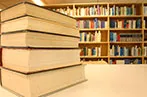 Books arranged on a table in a library