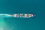 boat with shipping contains sailing through the ocean.