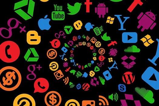 A bunch of tech and social media icons in a spiral on a black background