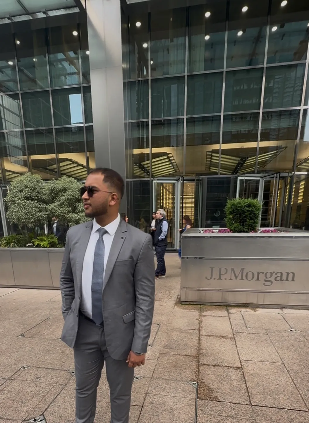 Abdul standing in front of the Morgan Stanley building