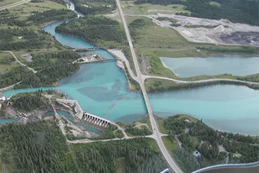 Alberta Bow Valley dam surrounded by blue water and trees