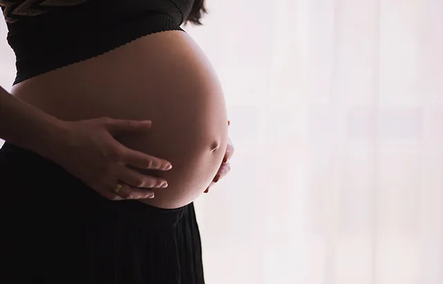 Image of pregnant woman. Photo by freestocks on Unsplash