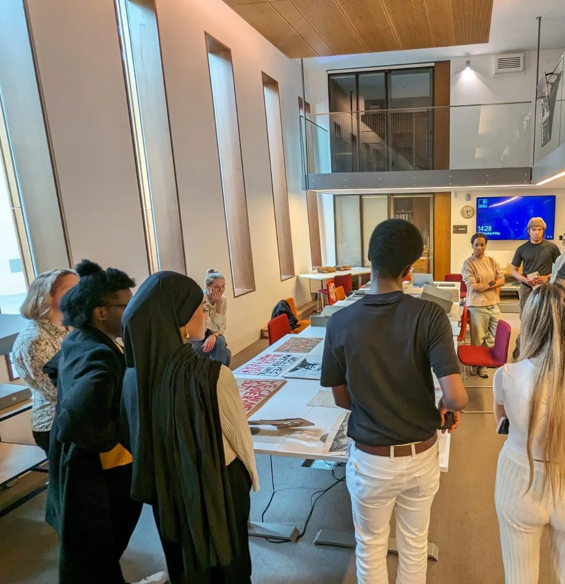 A group of students stand in a circle