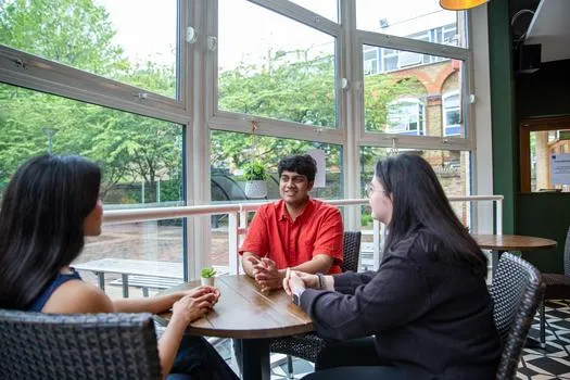 Students sat around a desk