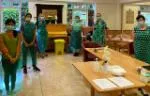 Queen Mary staff and student volunteers at a care home