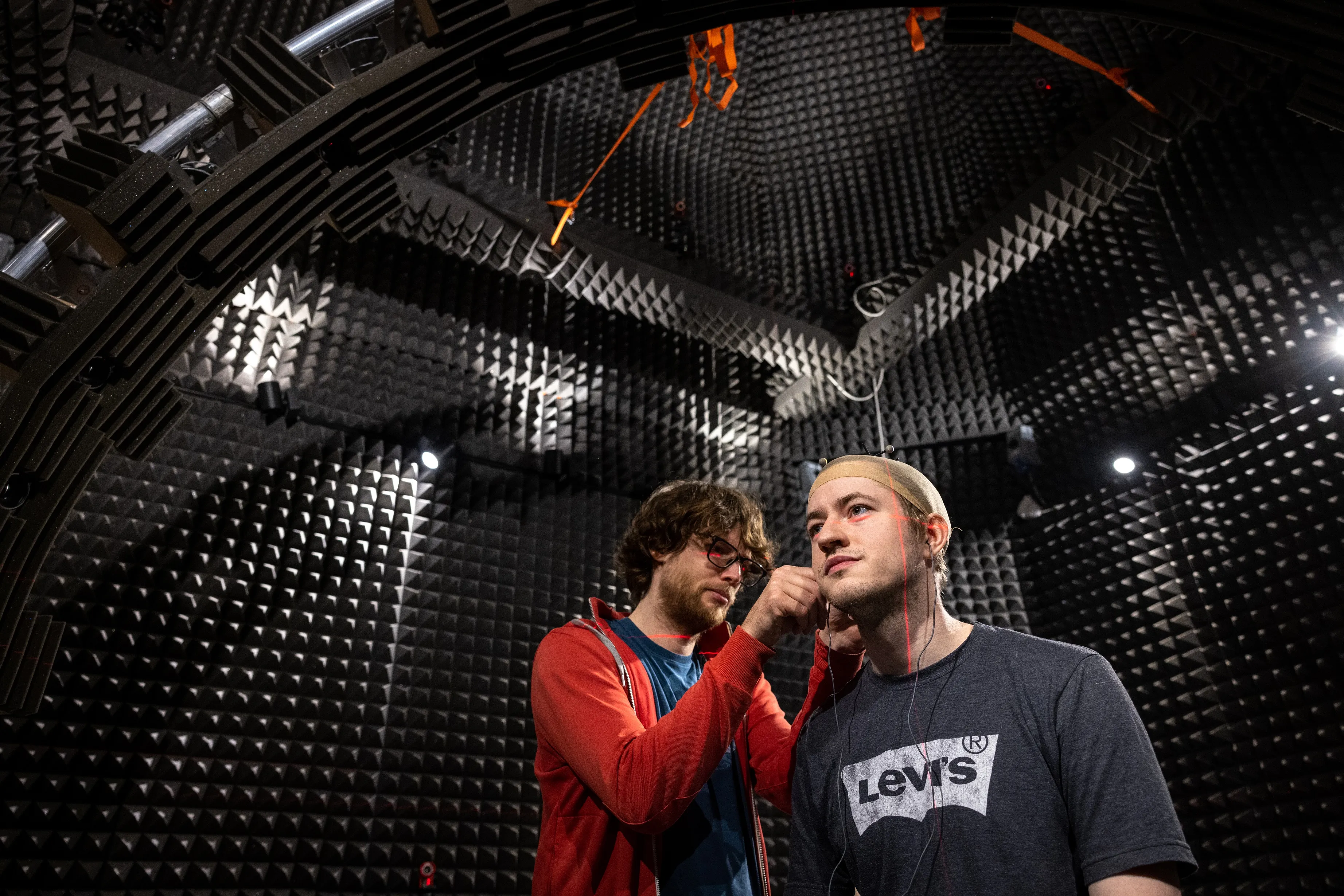 Two academics conducting an experiment around hearing aids