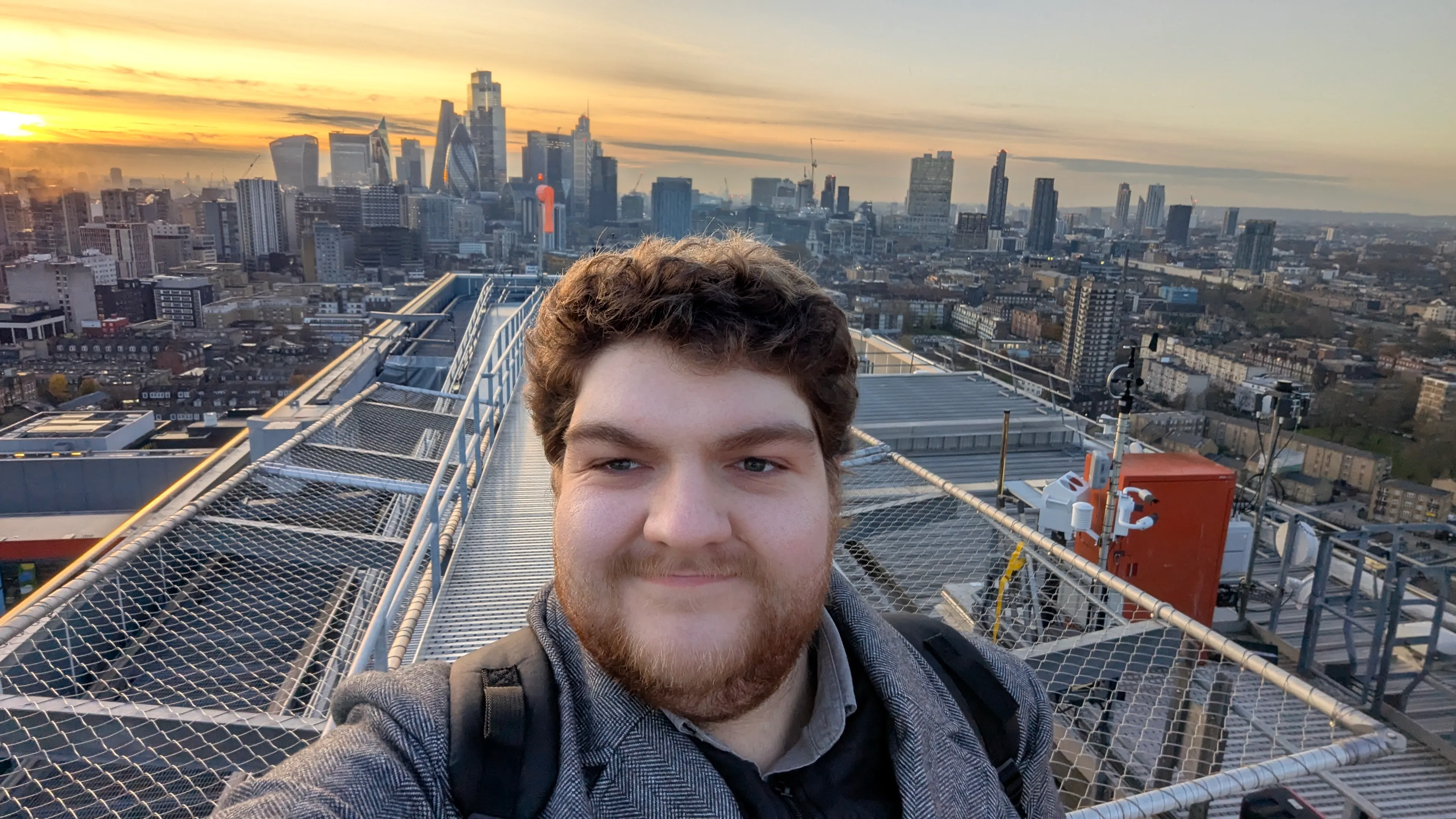 Dan Gill taking a selfie on a rooftop in London