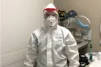 Person looking at camera wearing PPE equipment