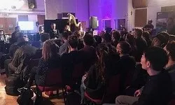 Crowd of people listening to a live concert