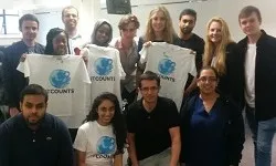 Group of students looking at camera and holding certificates