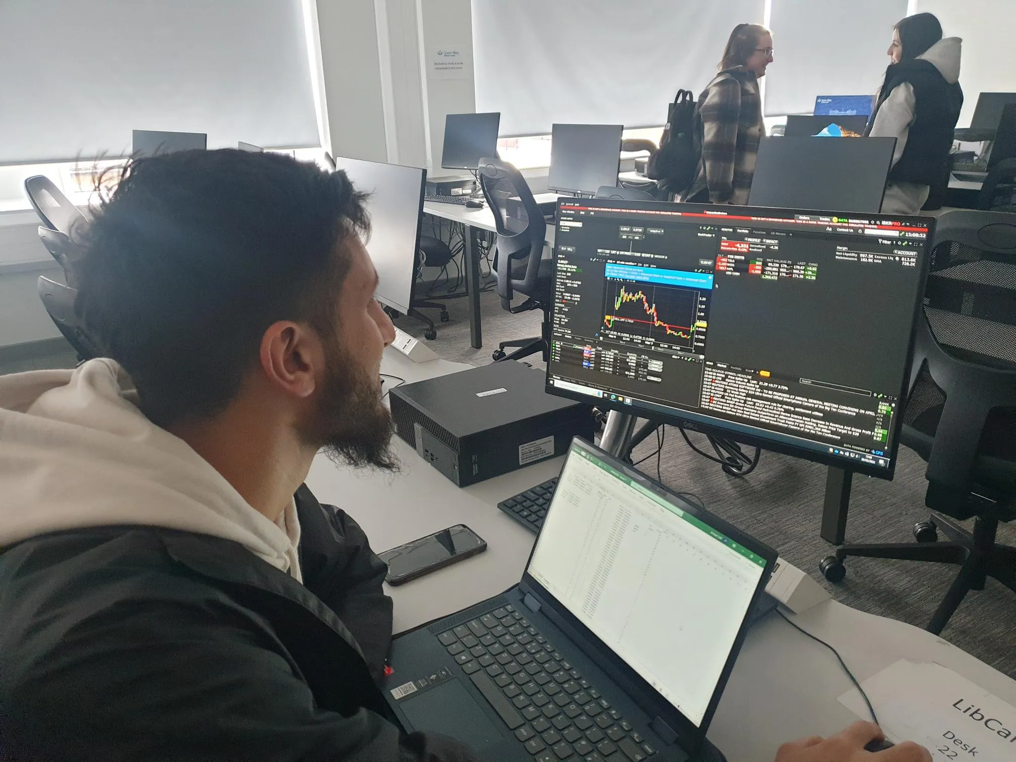 A student sitting at a laptop