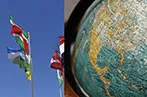 Image of flags blowing in the wind on the left and a globe on the right