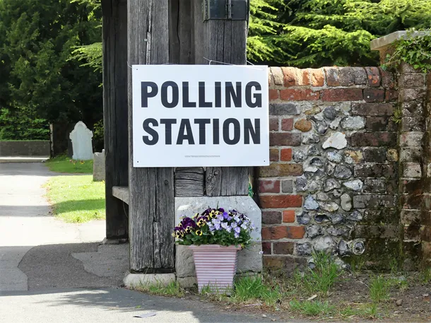 Sign on wall that reads Polling Station