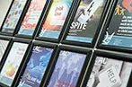 Posters of projects offered by the LAC hanging on the wall