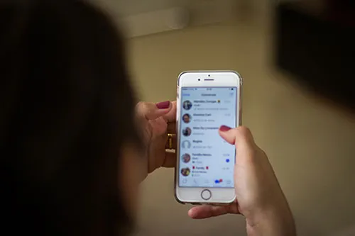 A person using Whatsapp on their phone