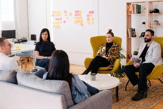 A group of people having a meeting in an office