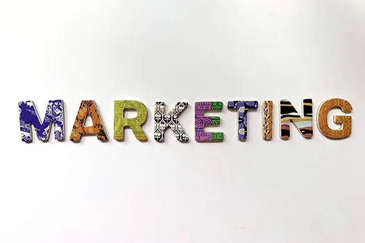The word 'Marketing' written out in capitals, with each letter a different colour and pattern