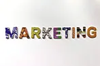 The word 'Marketing' written out in capitals, with each letter a different colour and pattern