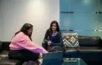 Two Centre for Commercial law Studies Students using a laptop.