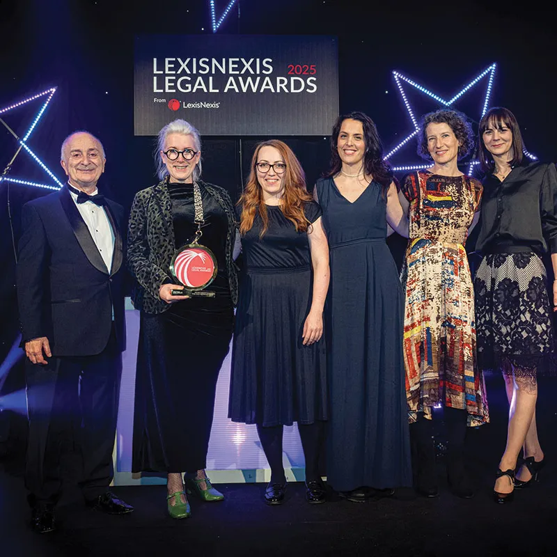 The qLegal team receiving their LexisNexis Award from Sir Tony Robinson..