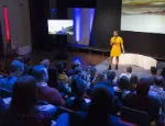 Woman presenting at a conference